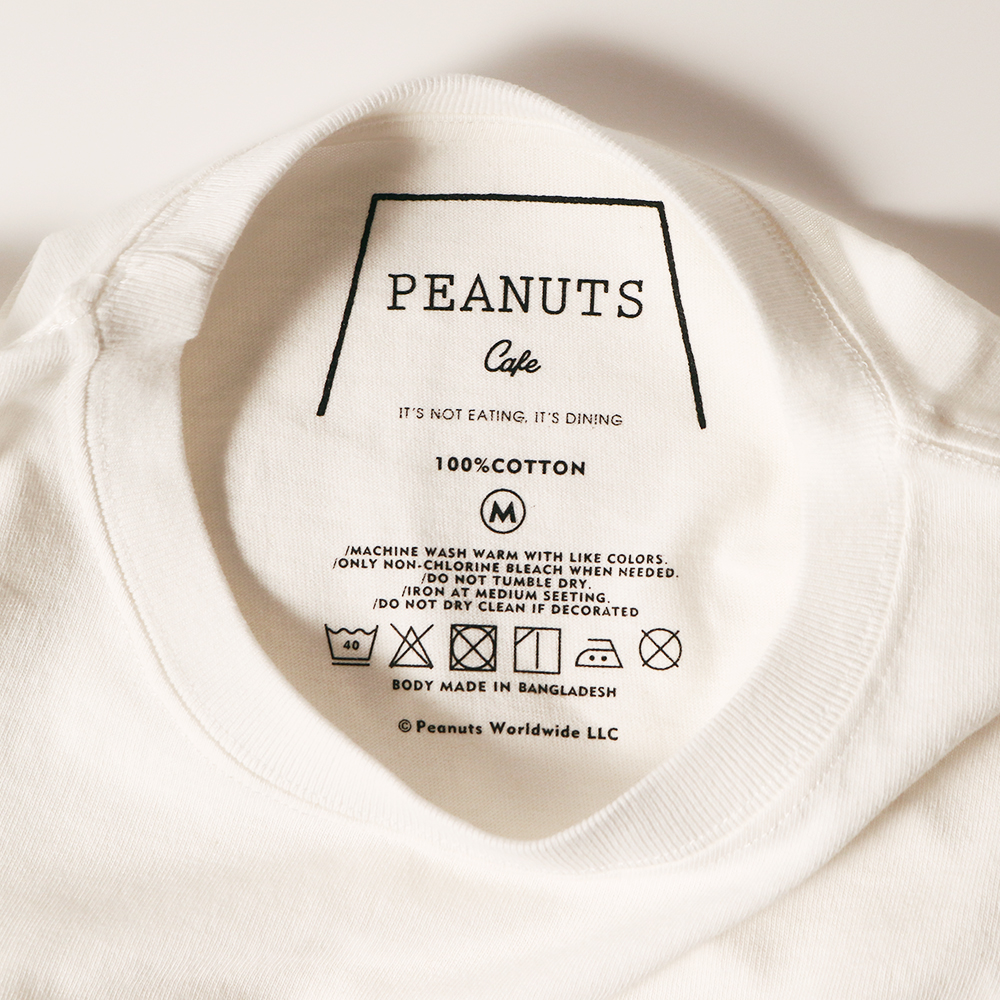 PEANUTS Cafe オリジナルTシャツ “NEVER MIND” ホワイト | PEANUTS